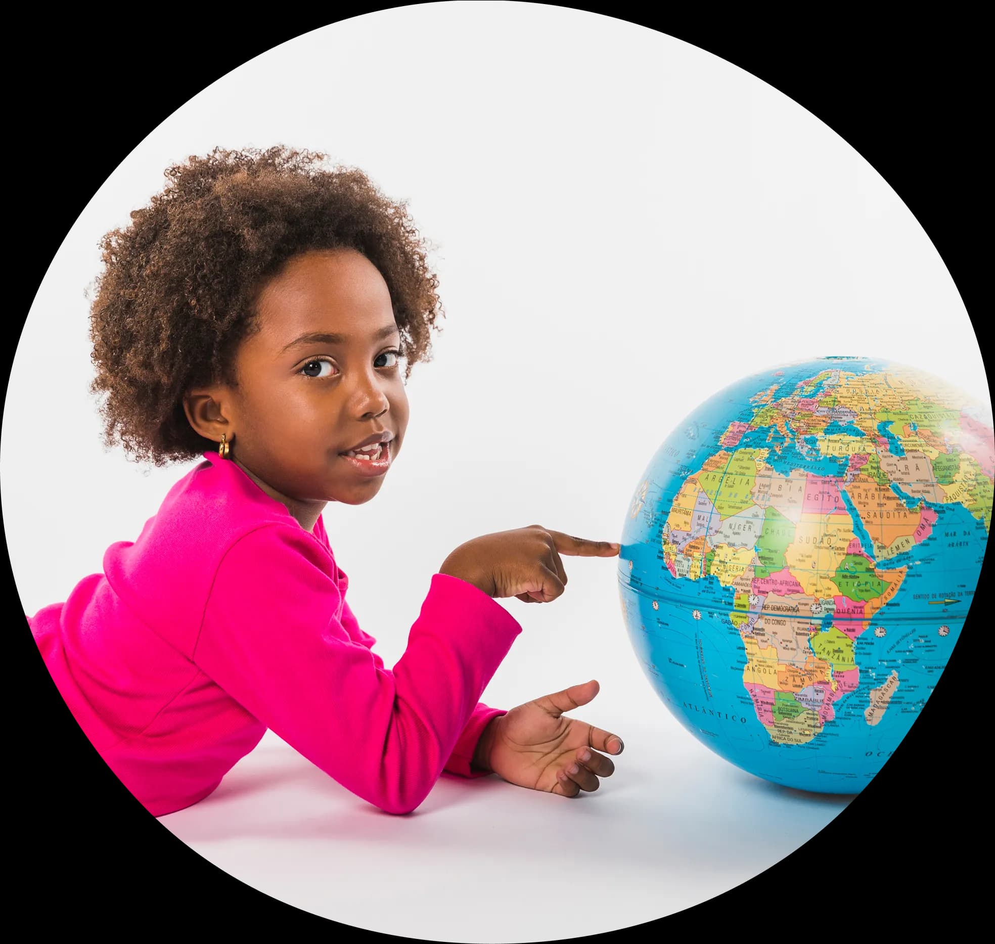 girl pointing at globe